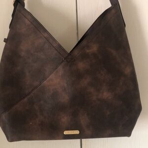 Woman’s brown Cluci handbag
